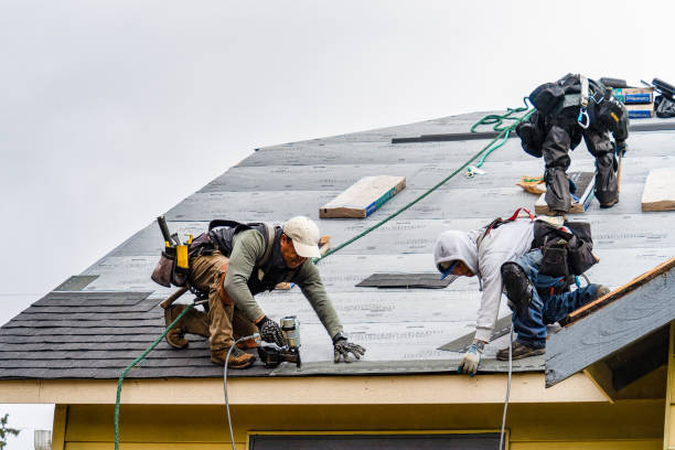 Professional Storm Damage Roof Repair technician working in Wakefield, MI